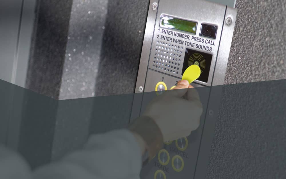 Person using door entry system at apartments