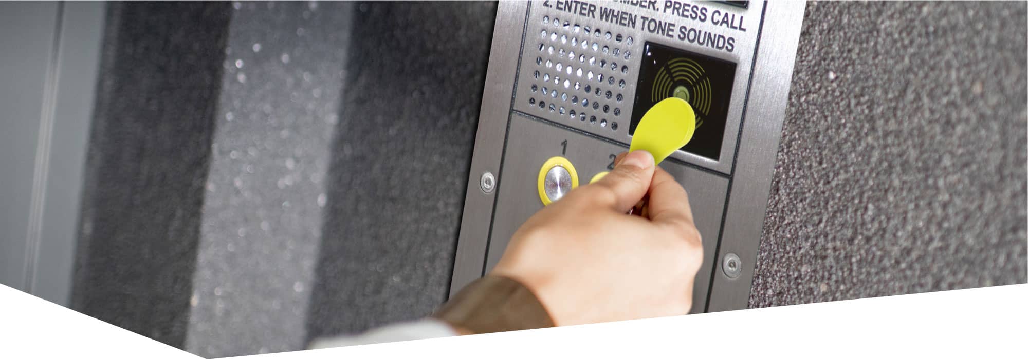 Person using door entry system at apartments